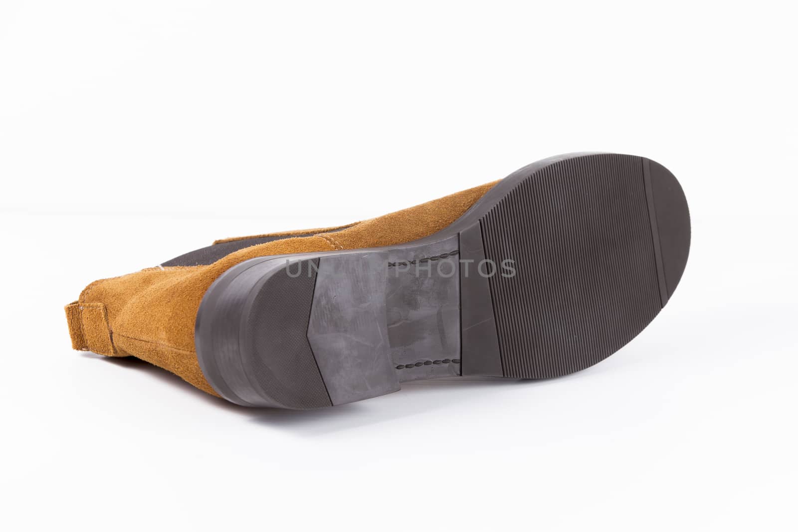 Brown leather boot on white background, isolated product.