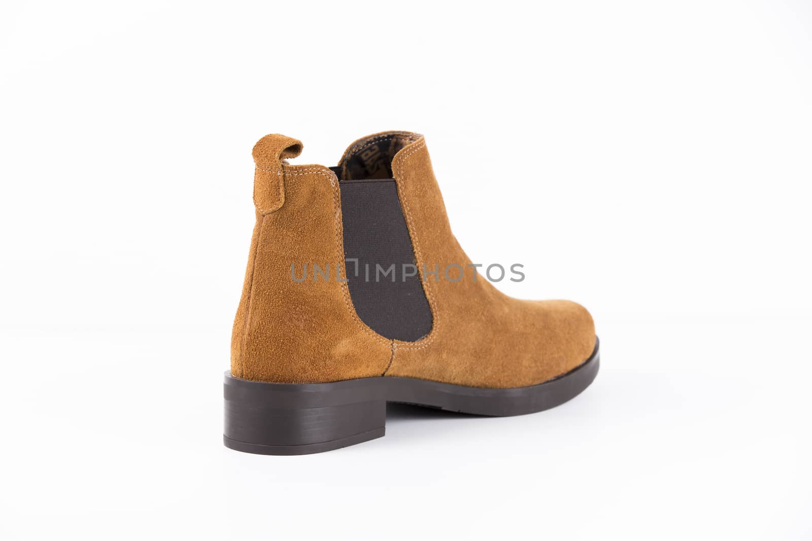 Brown leather boot on white background, isolated product.