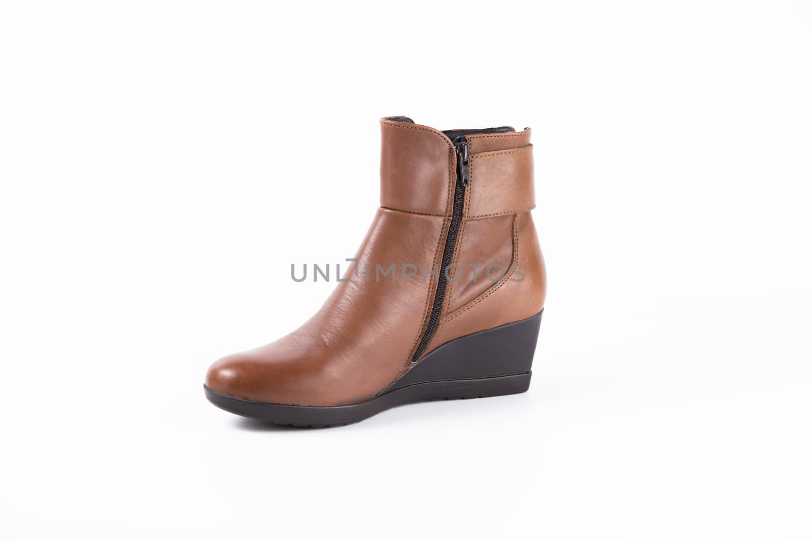 Brown leather boot on white background, isolated product. by GeorgeVieiraSilva