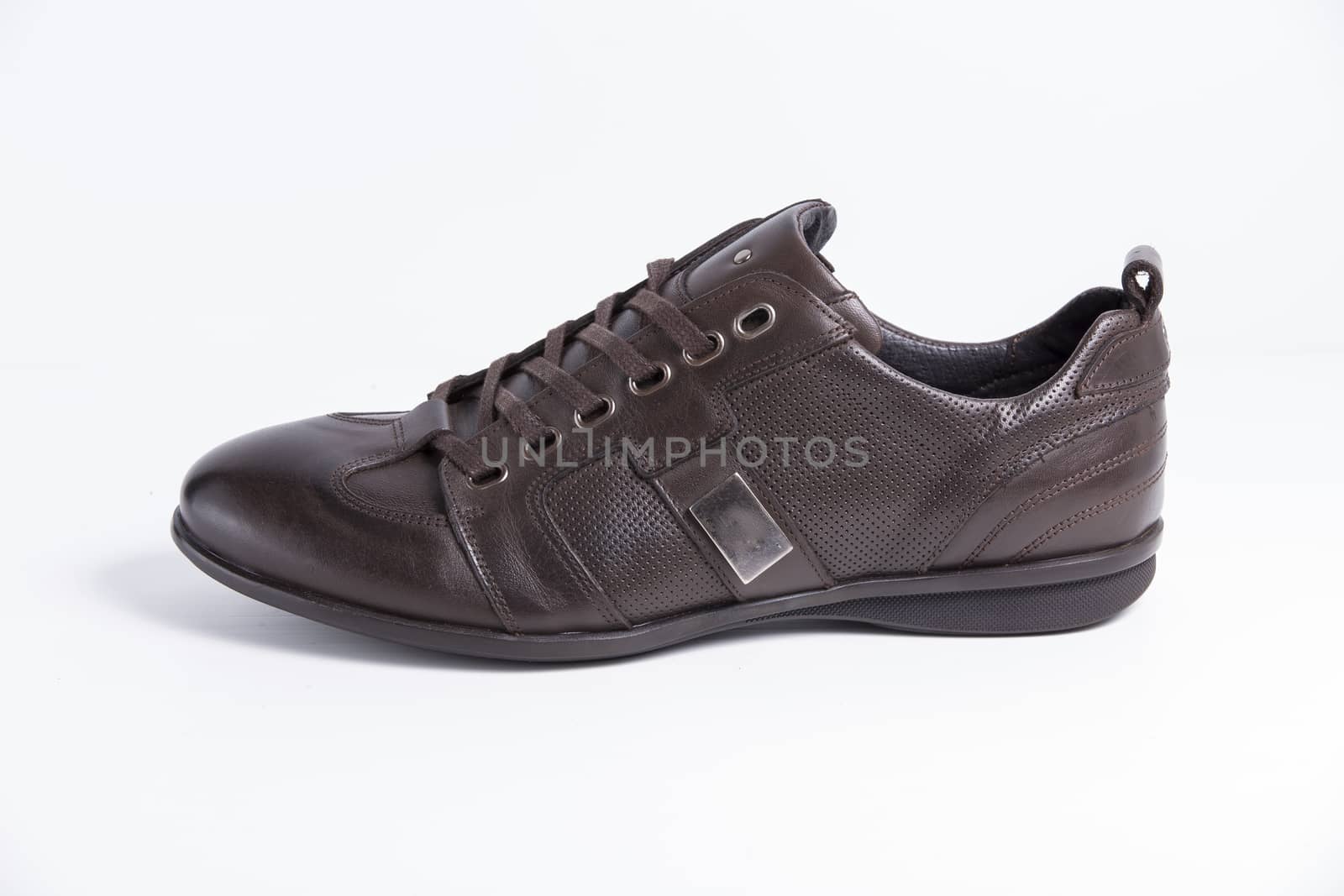 Brown leather shoe on white background, isolated product.