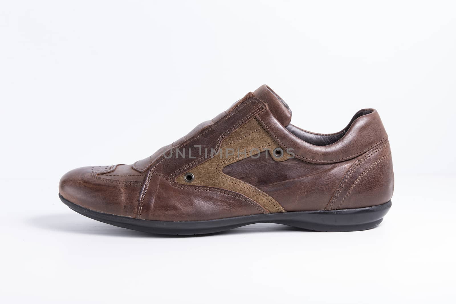 Brown leather shoe on white background, isolated product.