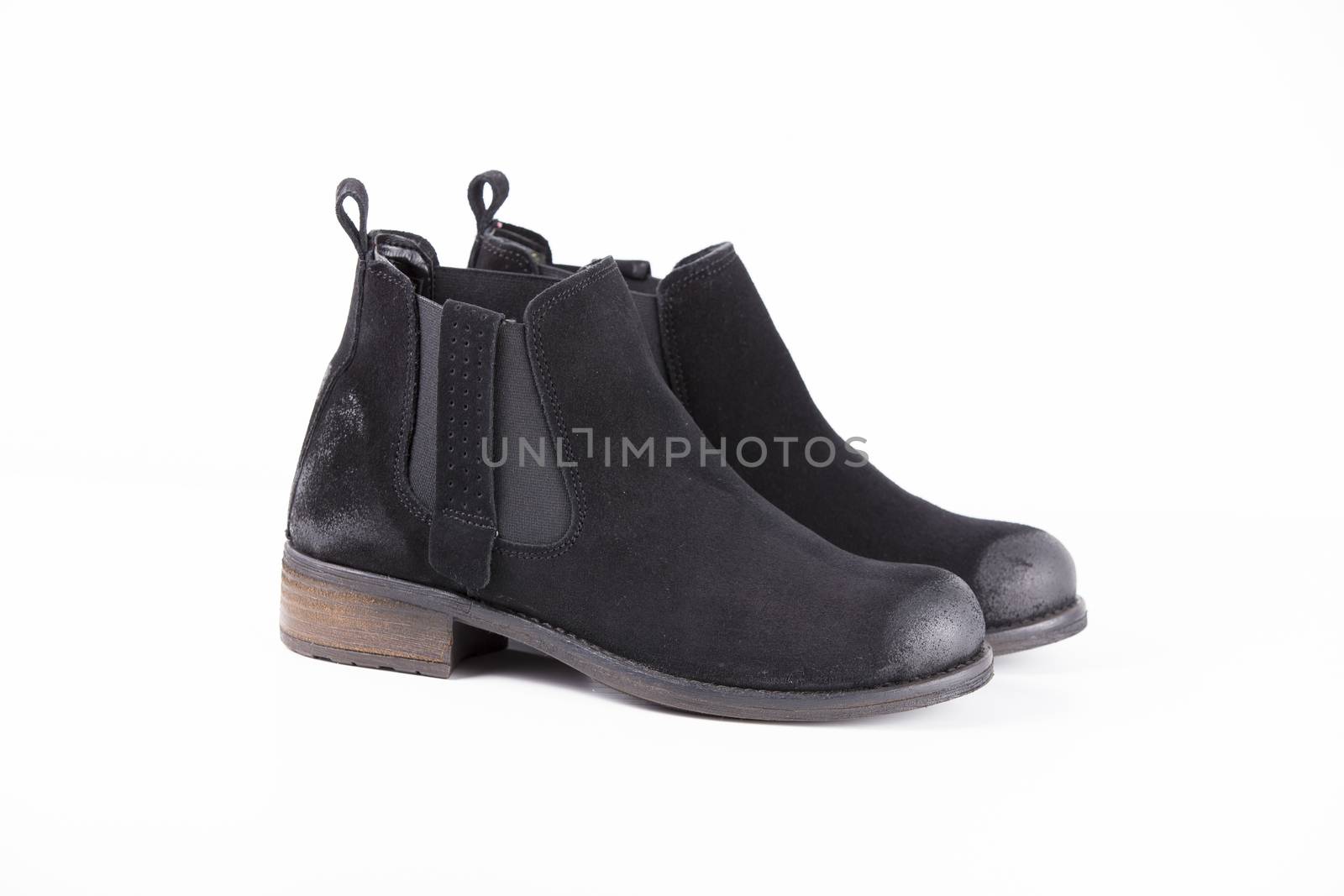 Pair of black leather boots on white background, isolated product. by GeorgeVieiraSilva