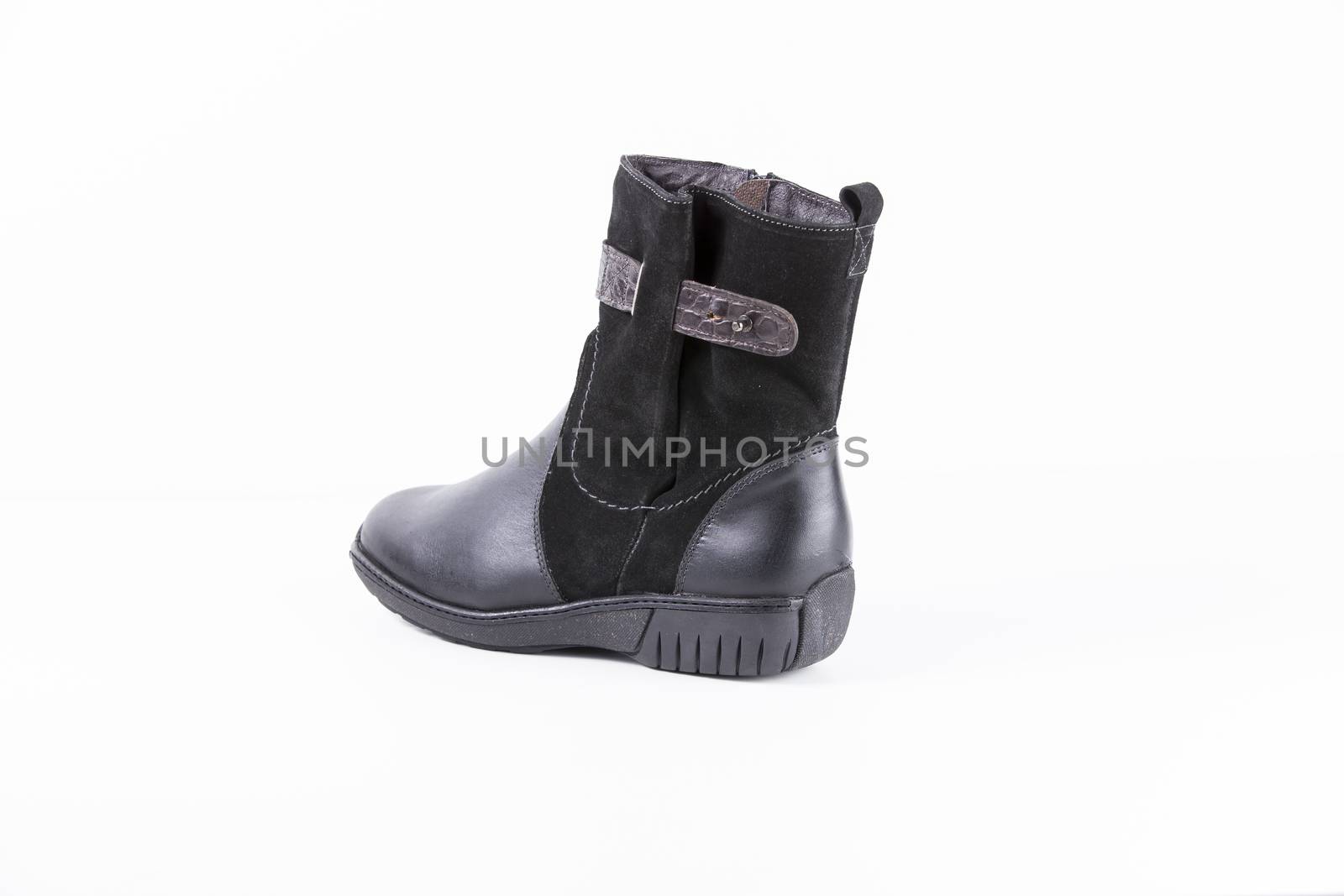Black leather boots on white background, isolated product.