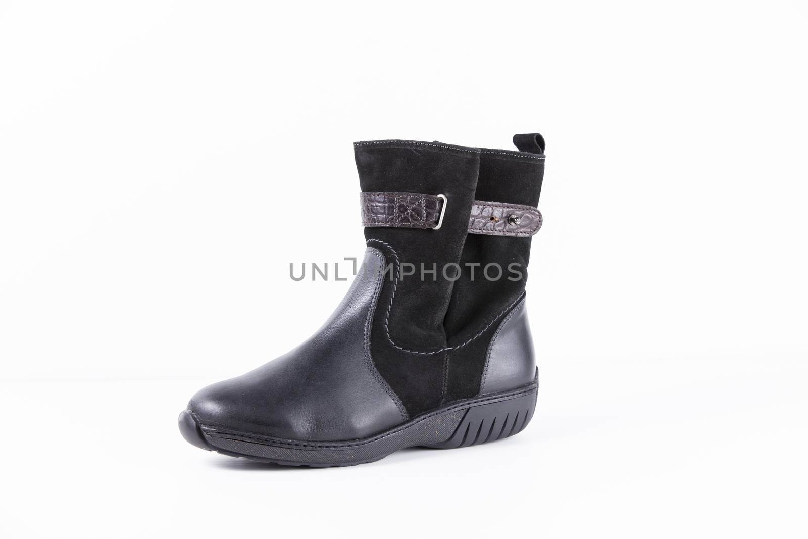 Black leather boots on white background, isolated product. by GeorgeVieiraSilva