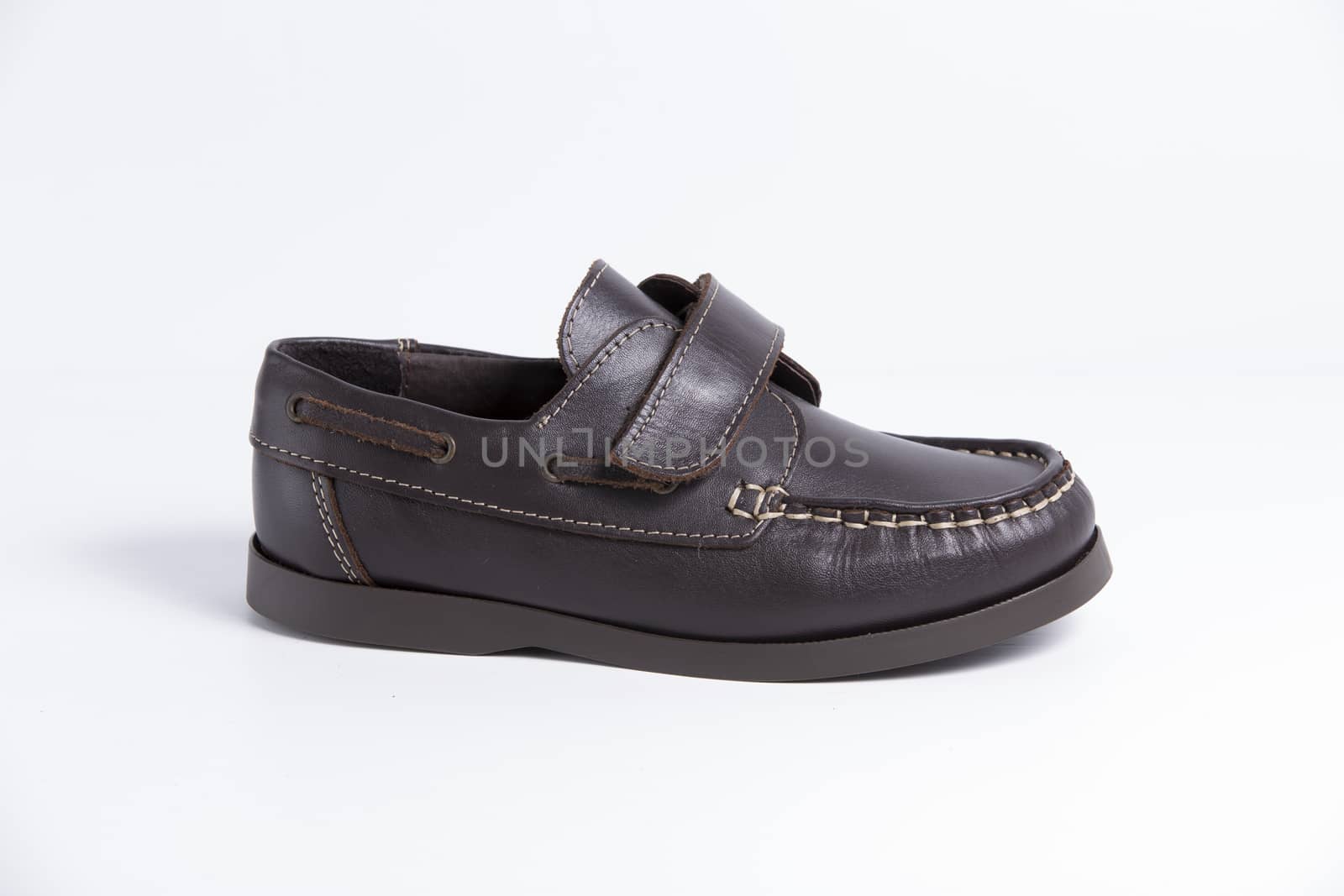 Male brown leather shoe on white background, isolated product.