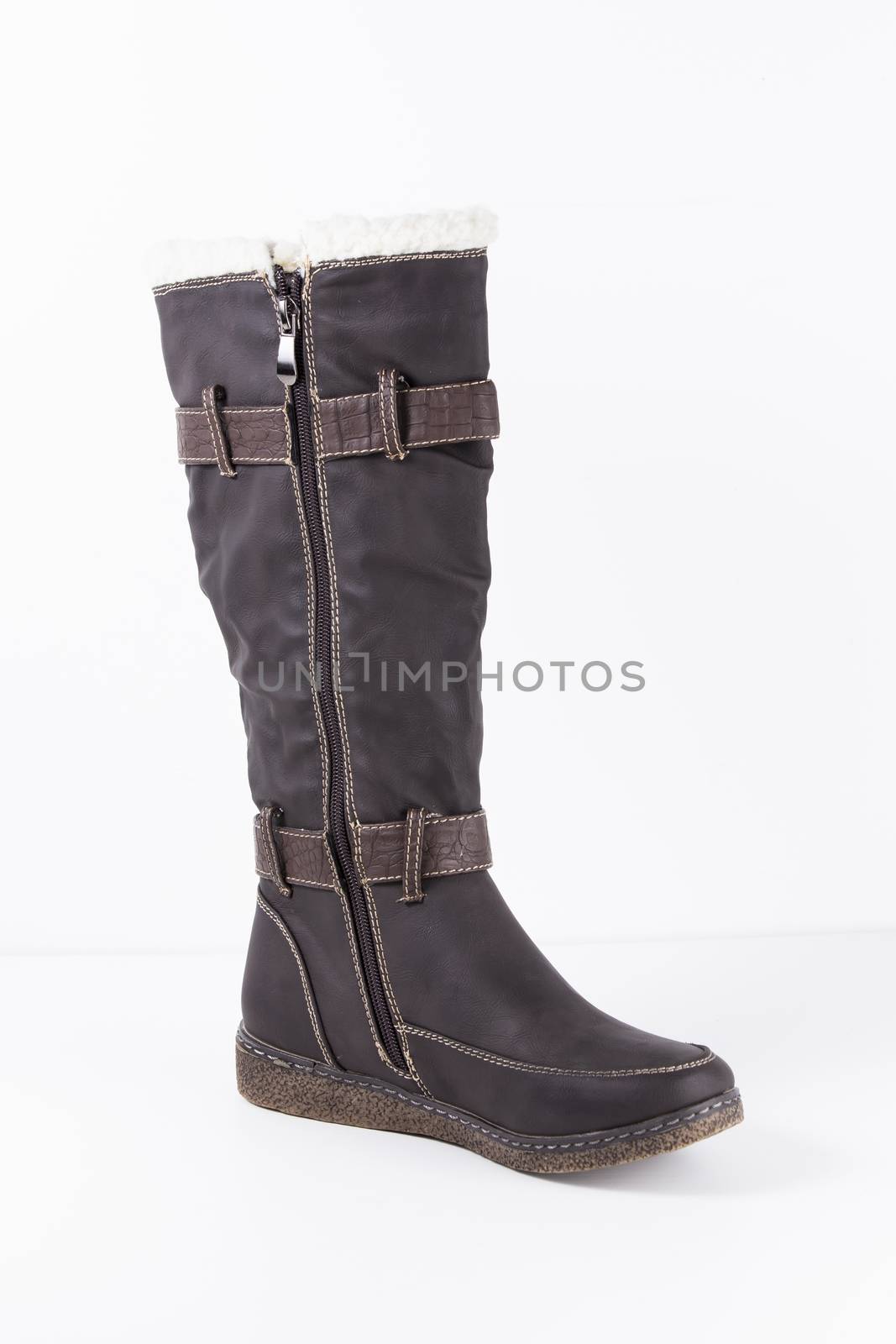 Brown leather boots on white background, isolated product.