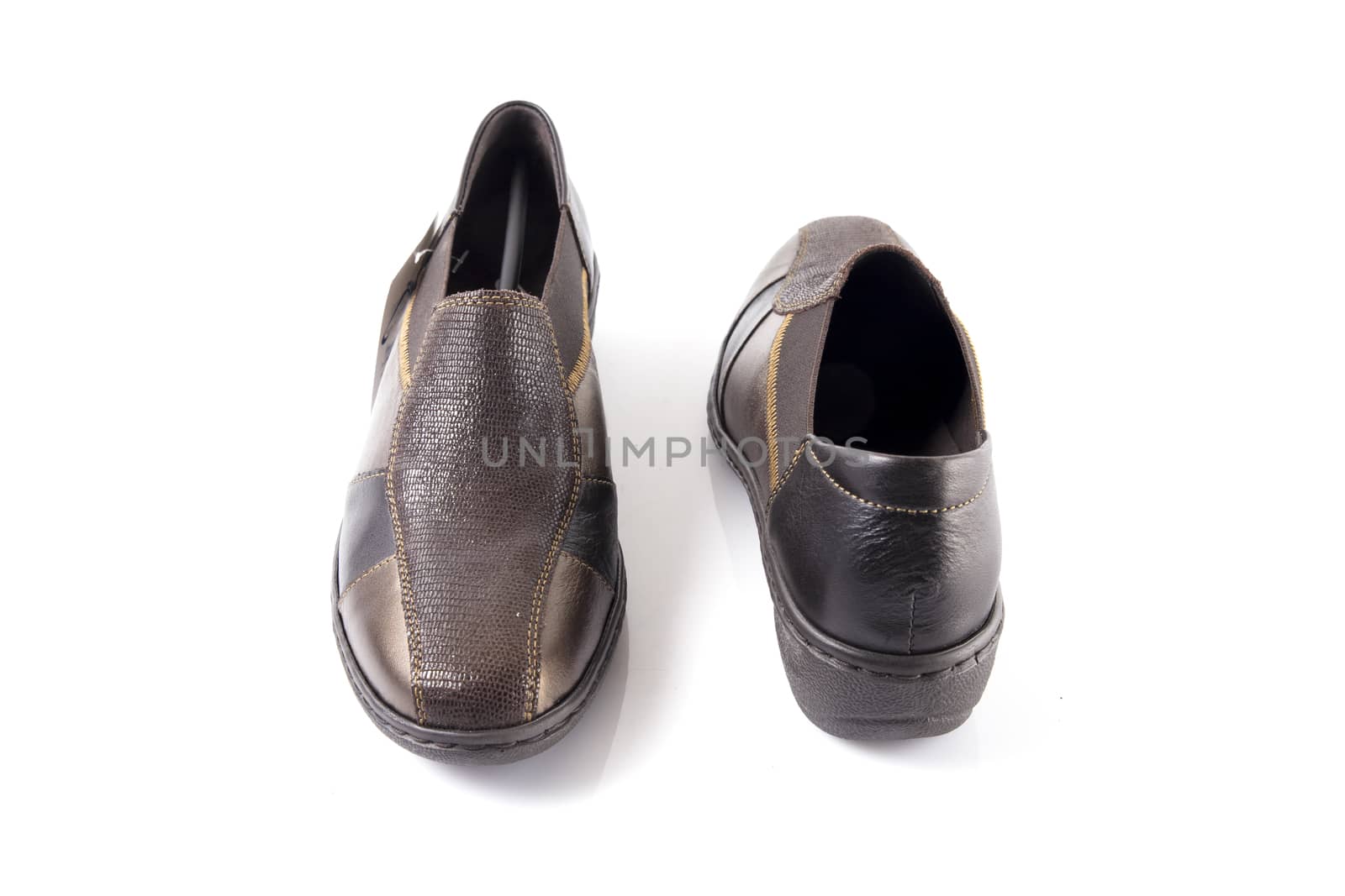 Pair of brown leather shoes on white background, isolated product, top view. by GeorgeVieiraSilva