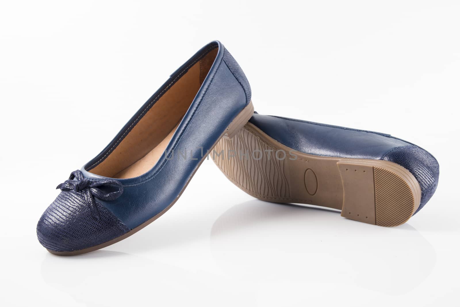 Pair of blue leather shoes on white background, isolated product, top view.