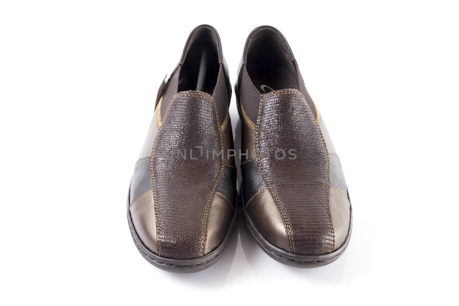 Pair of brown leather shoes on white background, isolated product, top view.