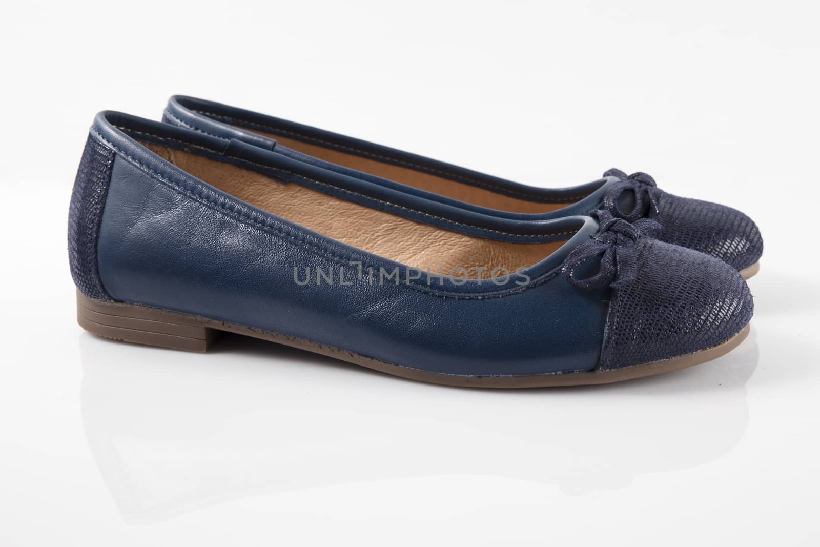 Pair of blue leather shoes on white background, isolated product, top view. by GeorgeVieiraSilva