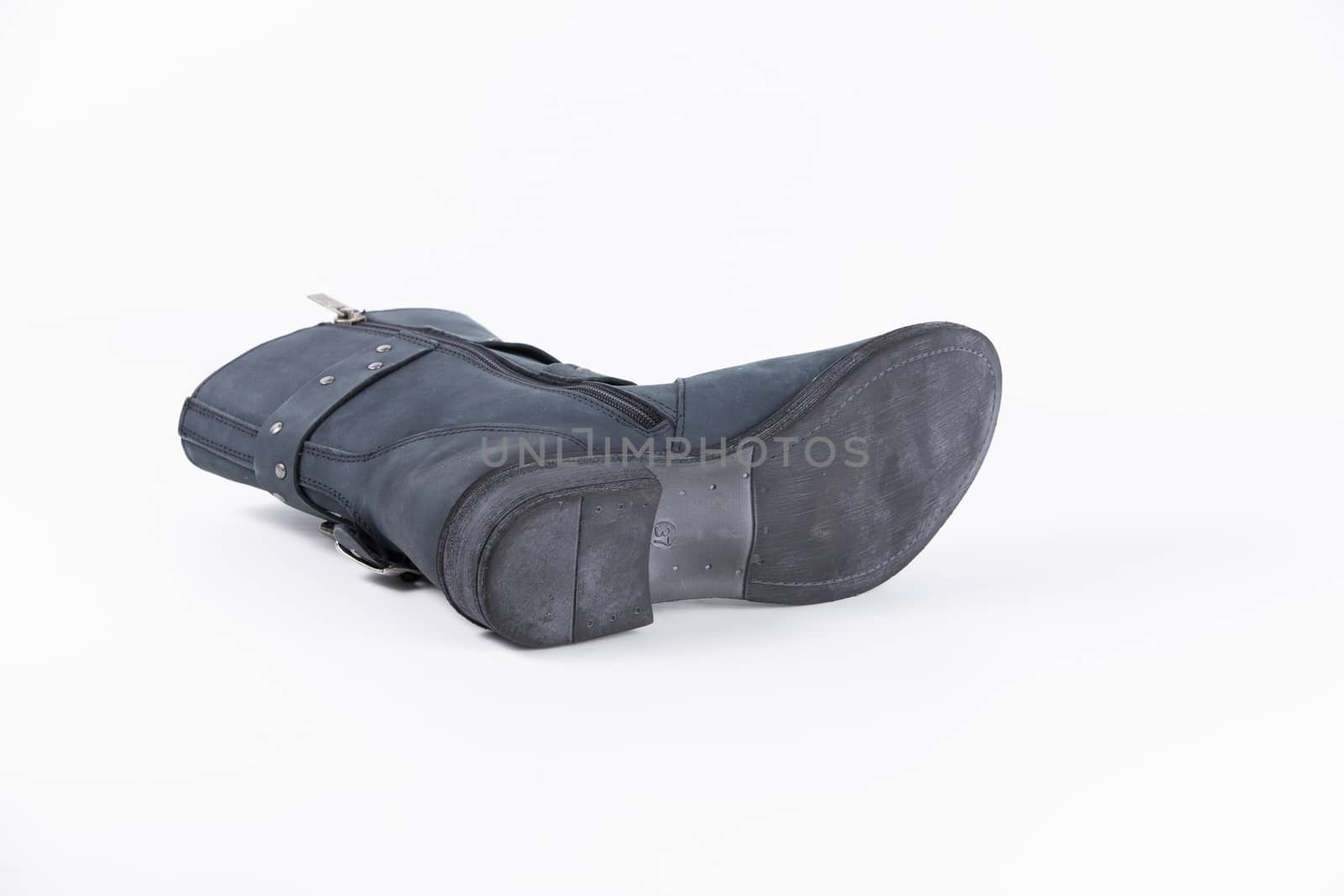 Female blue leather boots, isolated product.
