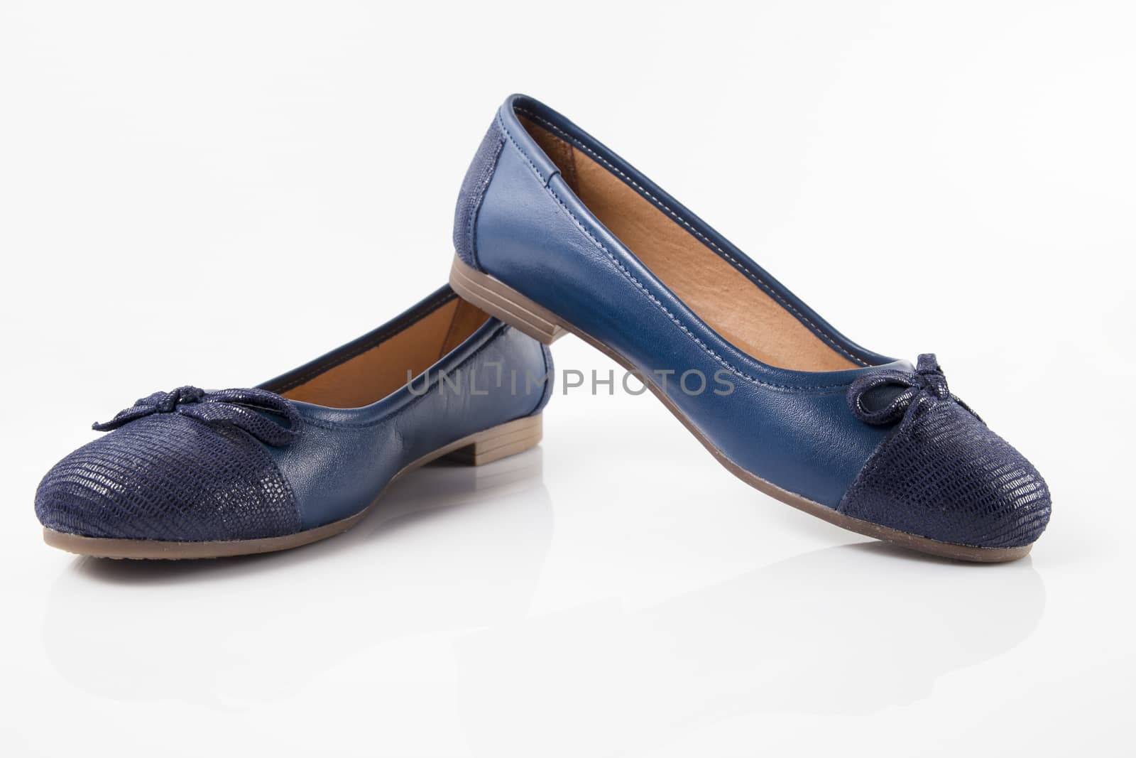 Pair of blue leather shoes on white background, isolated product, top view.