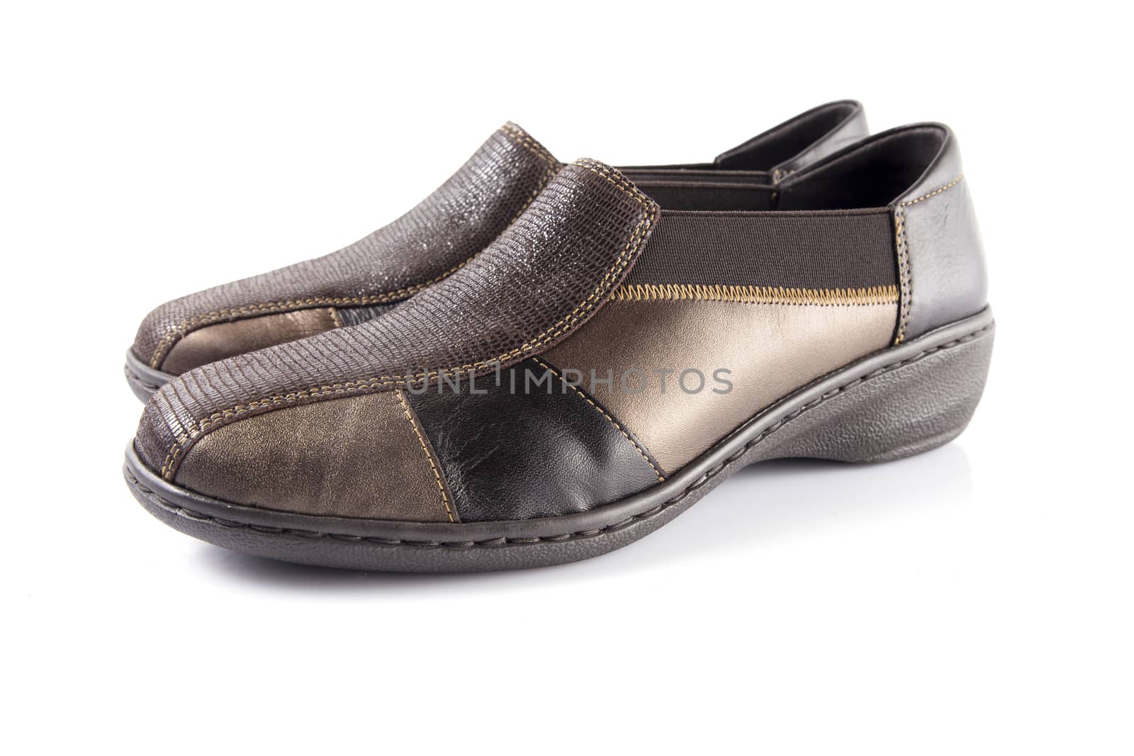 Pair of brown leather shoes on white background, isolated product, top view. by GeorgeVieiraSilva