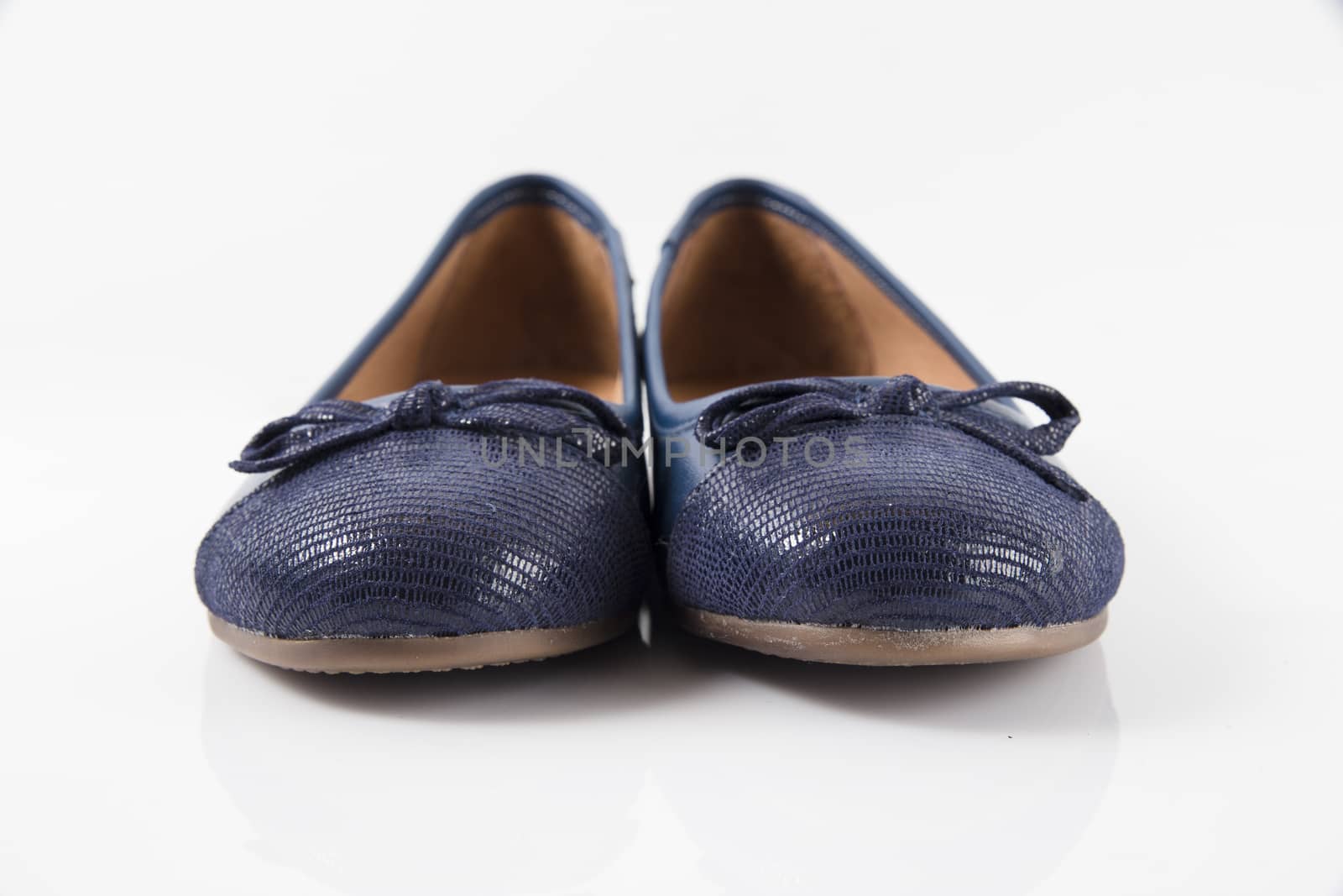 Pair of blue leather shoes on white background, isolated product, top view.
