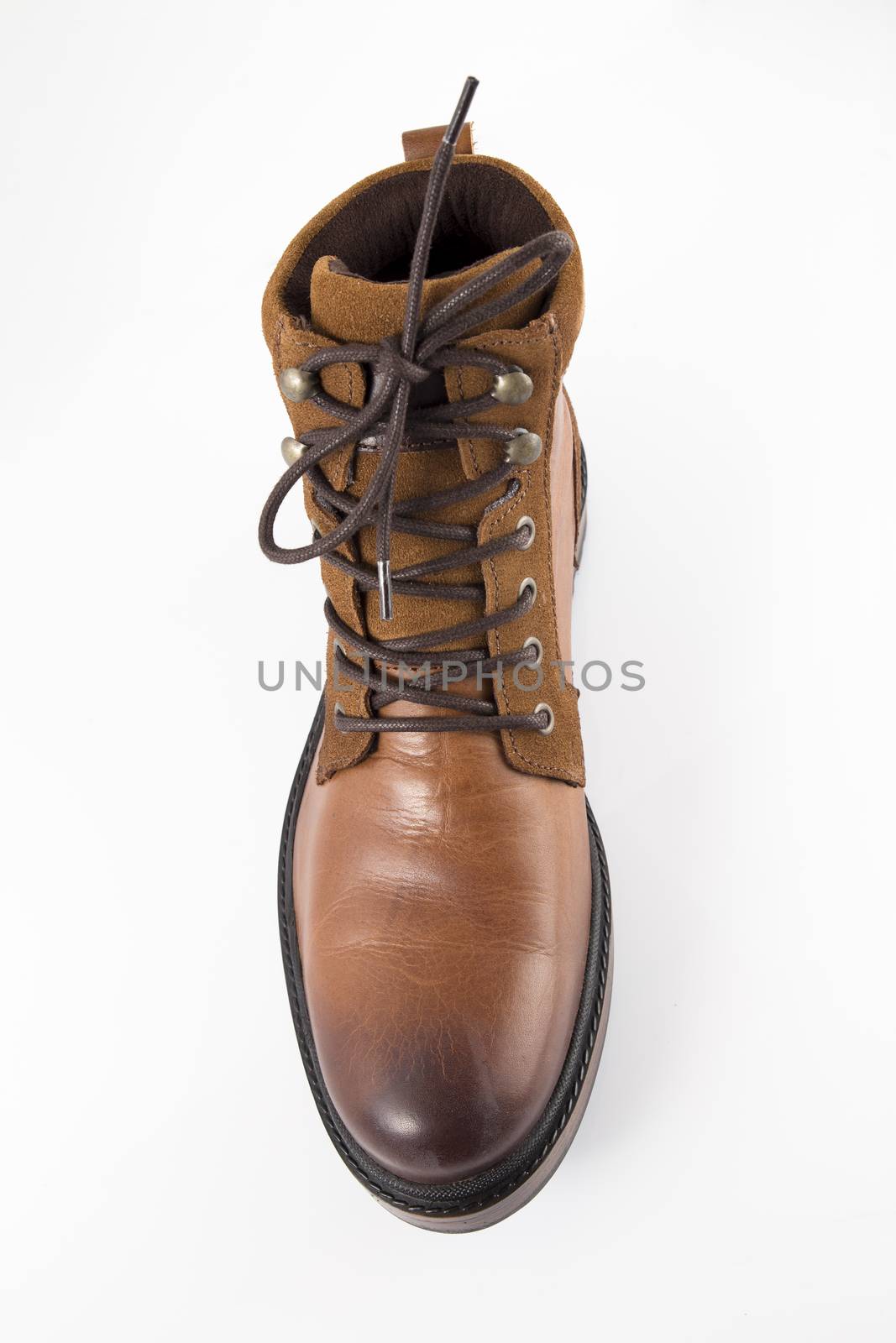 Brown leather boots on white background, isolated product, top view. by GeorgeVieiraSilva
