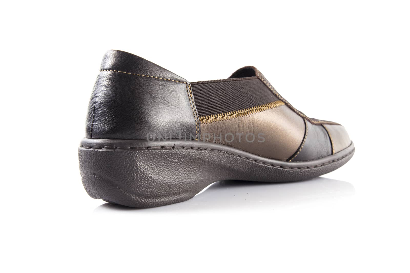 Brown leather shoes on white background, isolated product, top view.