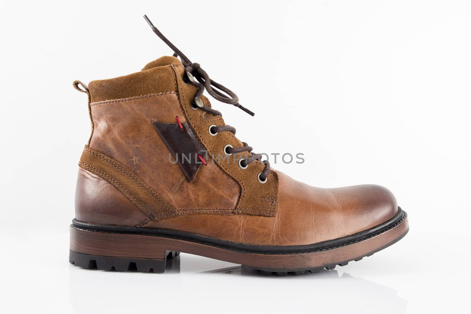 Brown leather boots on white background, isolated product, top view. by GeorgeVieiraSilva