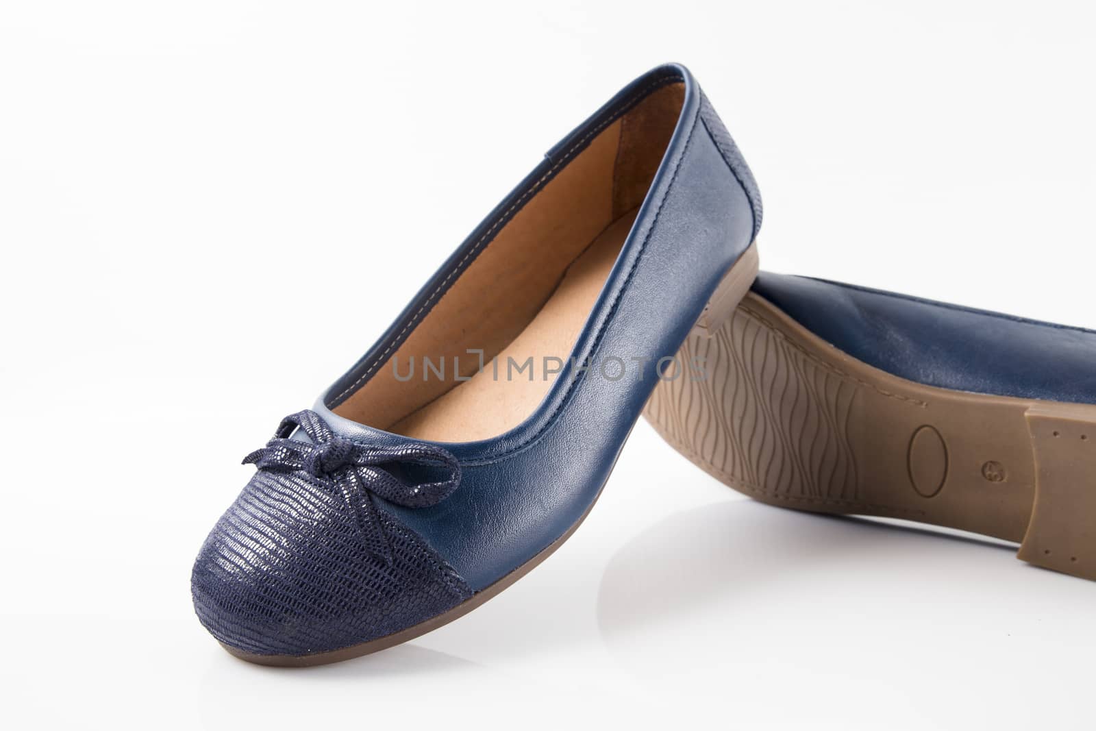 Pair of blue leather shoes on white background, isolated product, top view.