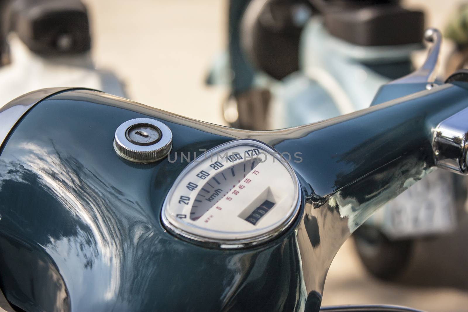 Detail of the handlebar and speedometer of a famous two-wheeled vehicle Italian: La Vespa. A piece of history of Italian vehicles.