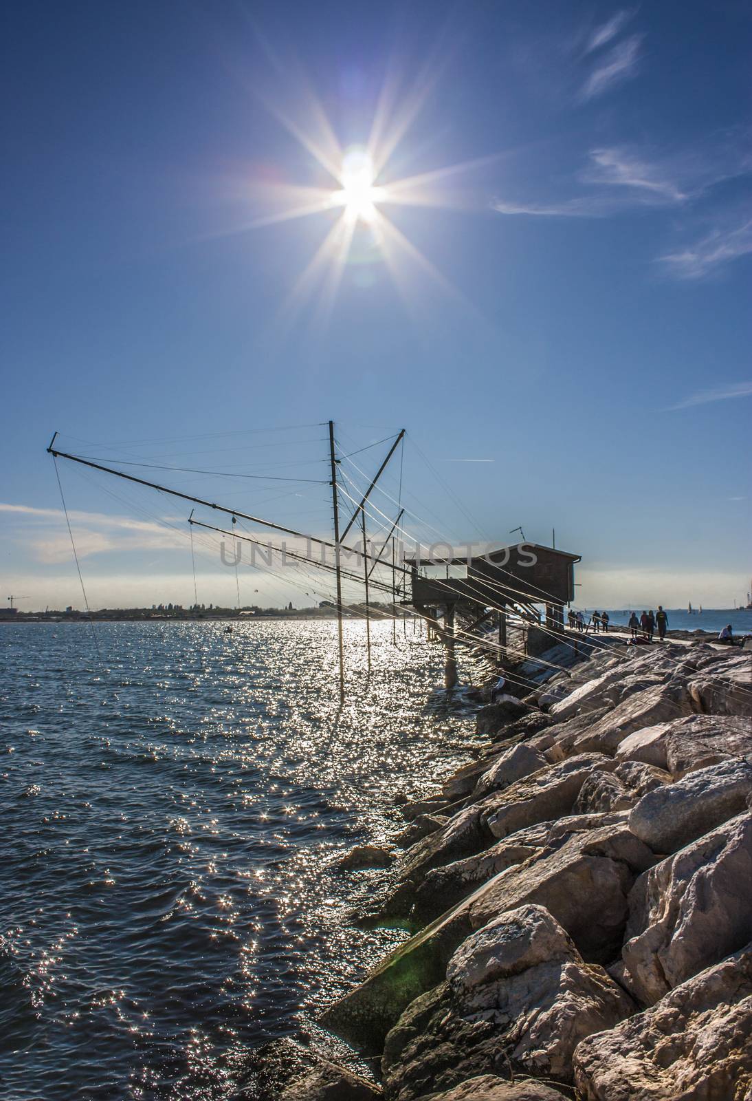 Beautiful landscape of Sottomarina, resort near Venice. A small dam in the sea backlit shooting with HDR technique.