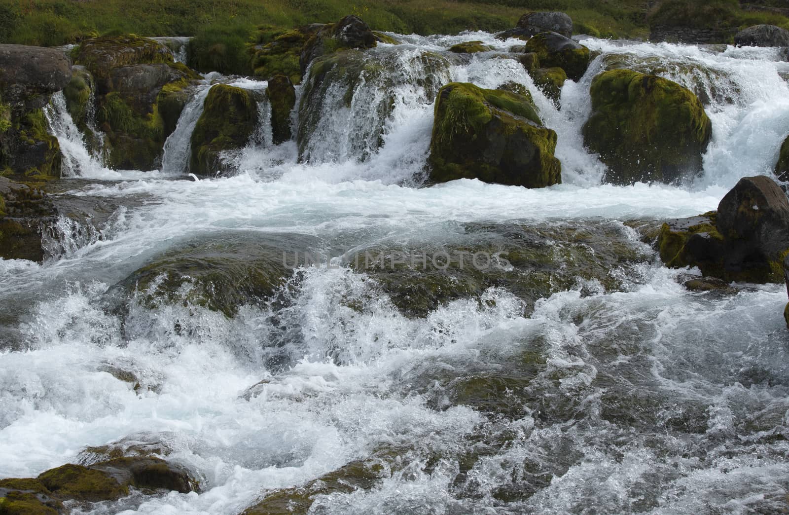 Water Splashing Between Stones in Waterfall