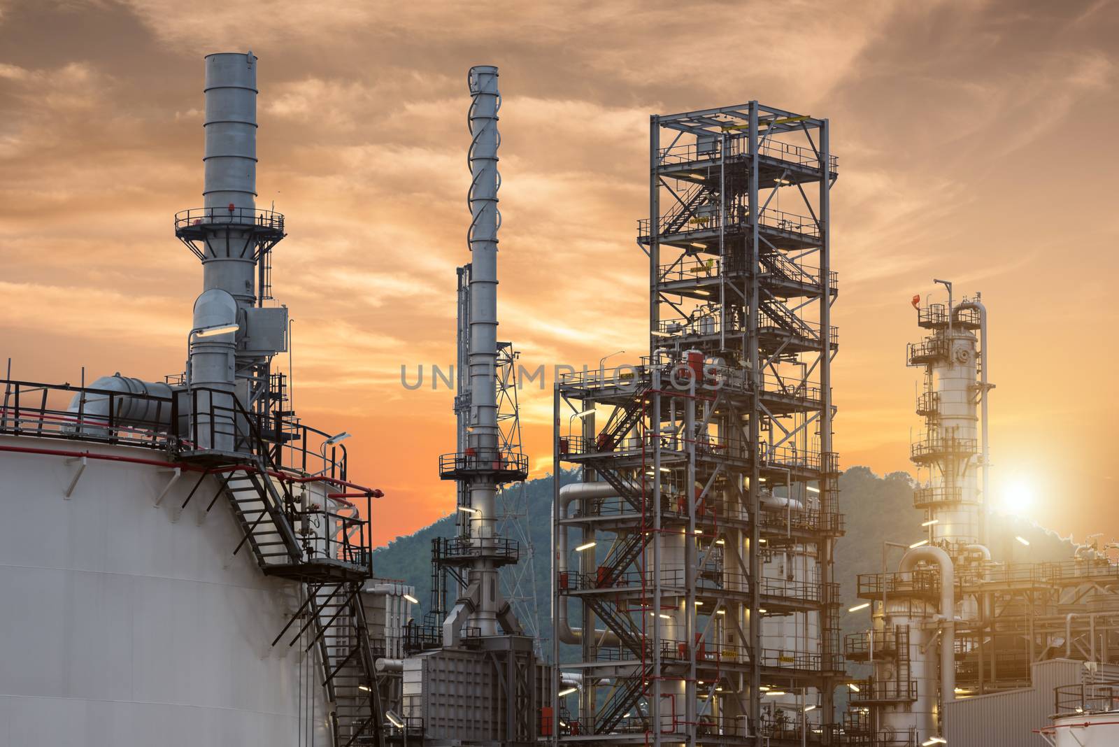 Oil Refinery factory Petroleum at twilight sunset, petrochemical plant