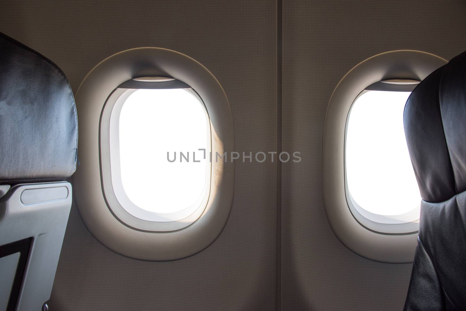 white windows inside an aircraft by Sorapop