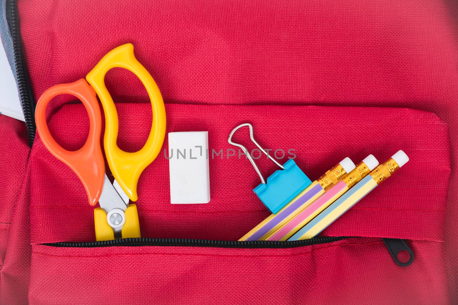 Top view Red bag backpack for education children on blue background back to school concept