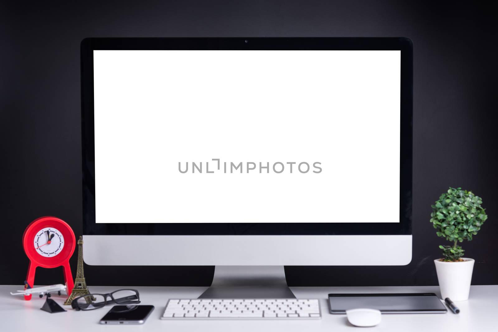 Office Computer on white wooden table and mobile phone