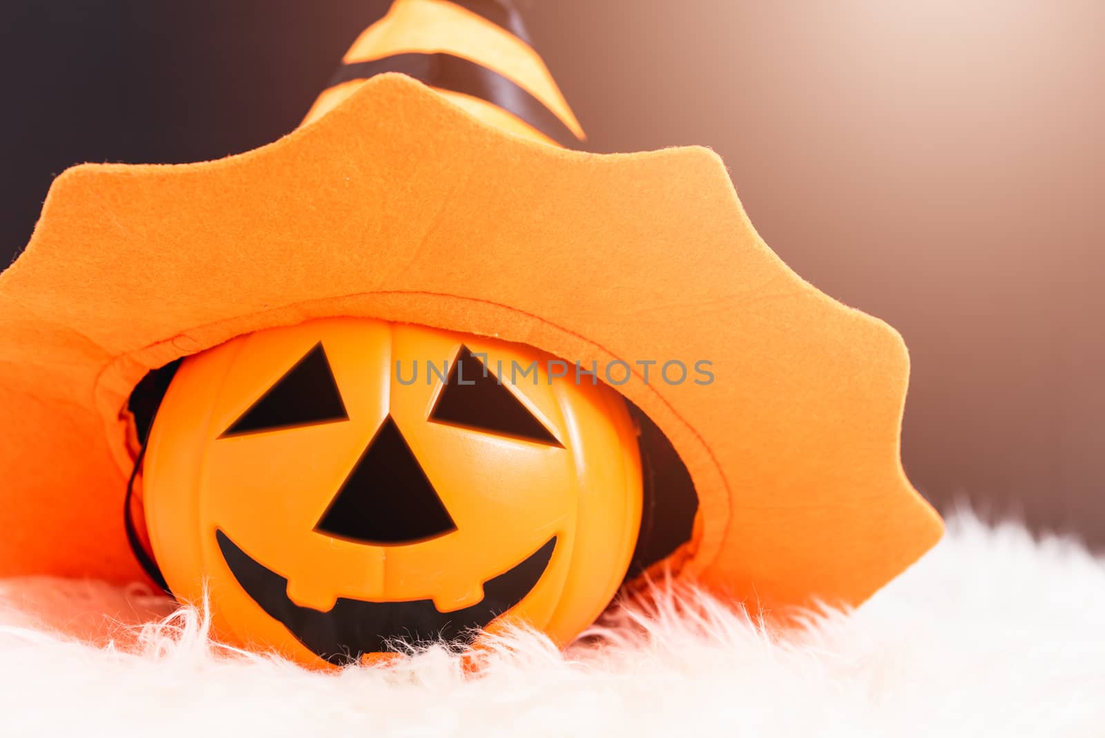 Pumpkin Jack orange color with hat on head this horror in Halloween day on black background
