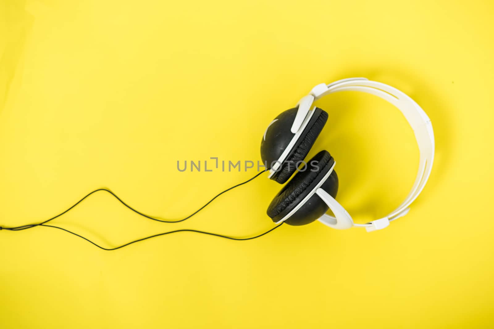 Closeup Music Headphones on a yellow background