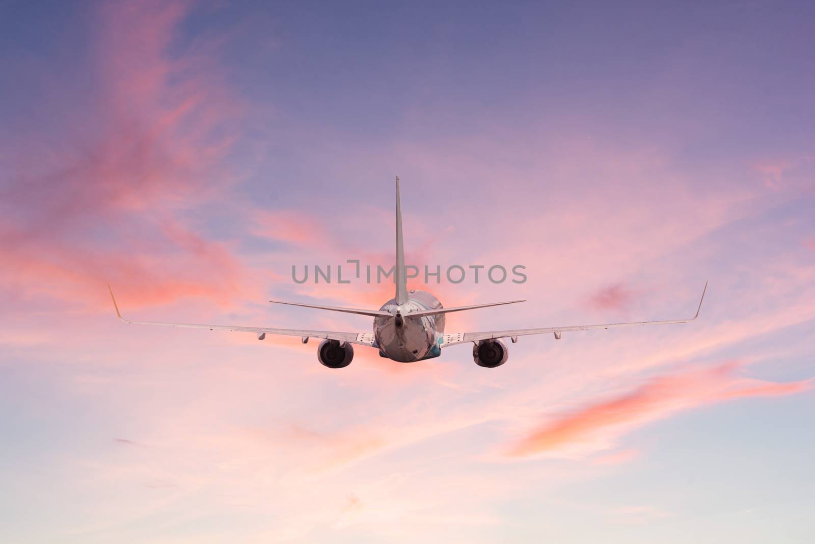 Airplane aft plane in the sky at sunset sky