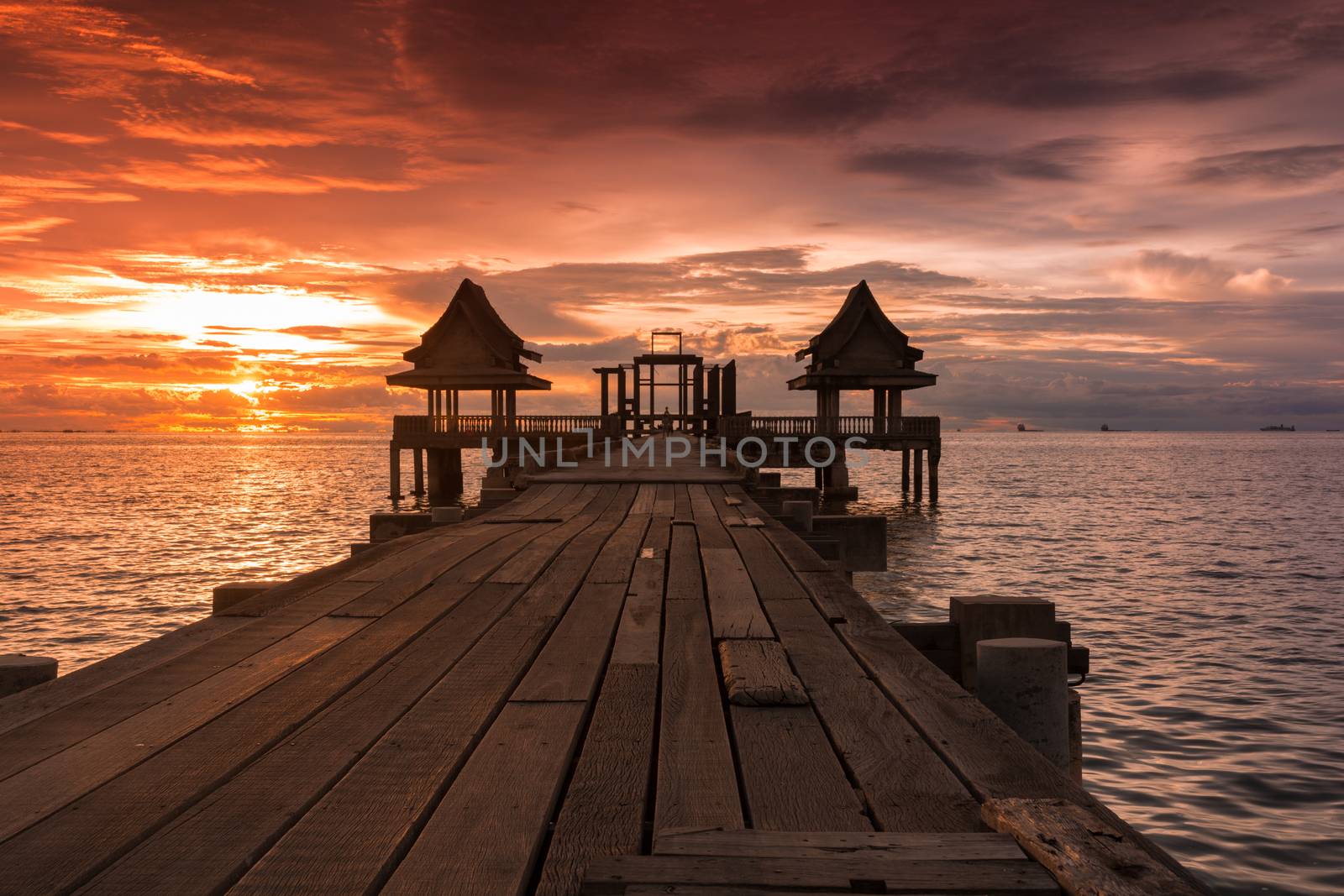 Twilight sunset wood bridge at Djittabhawan Temple tourist attraction in Pattaya, Thailand