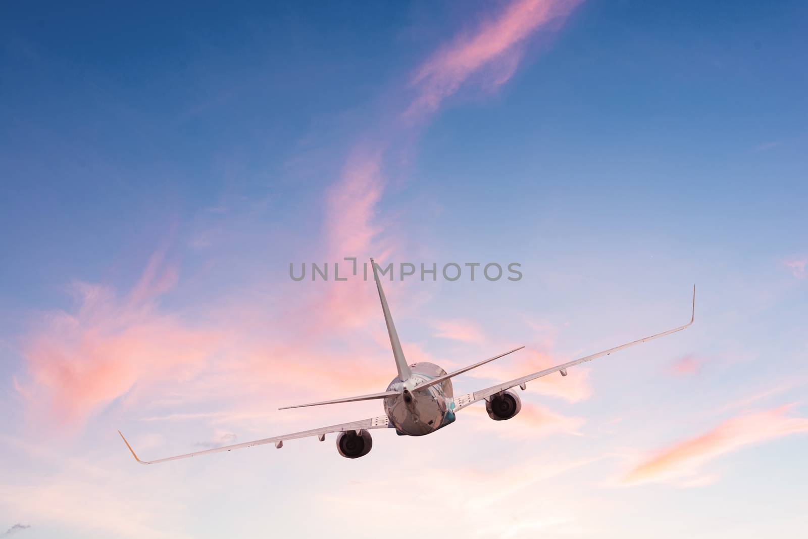 Airplane aft plane in the sky at sunset sky