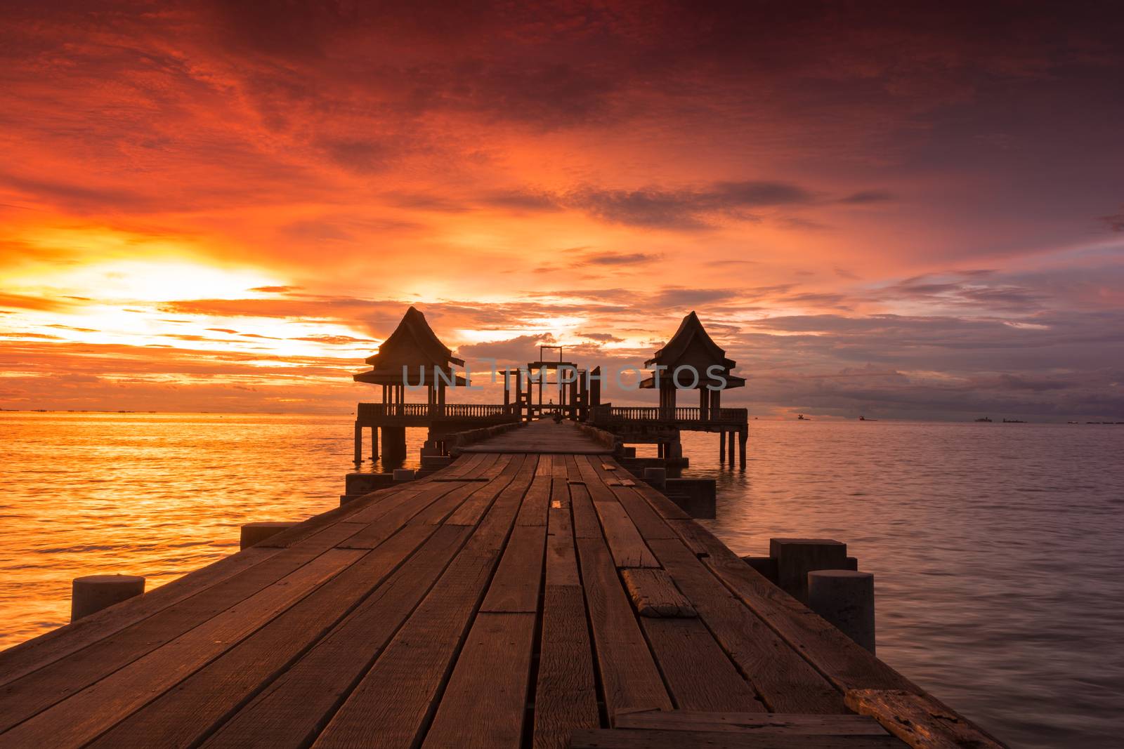 Twilight sunset wood bridge at Djittabhawan Temple tourist attraction in Pattaya, Thailand