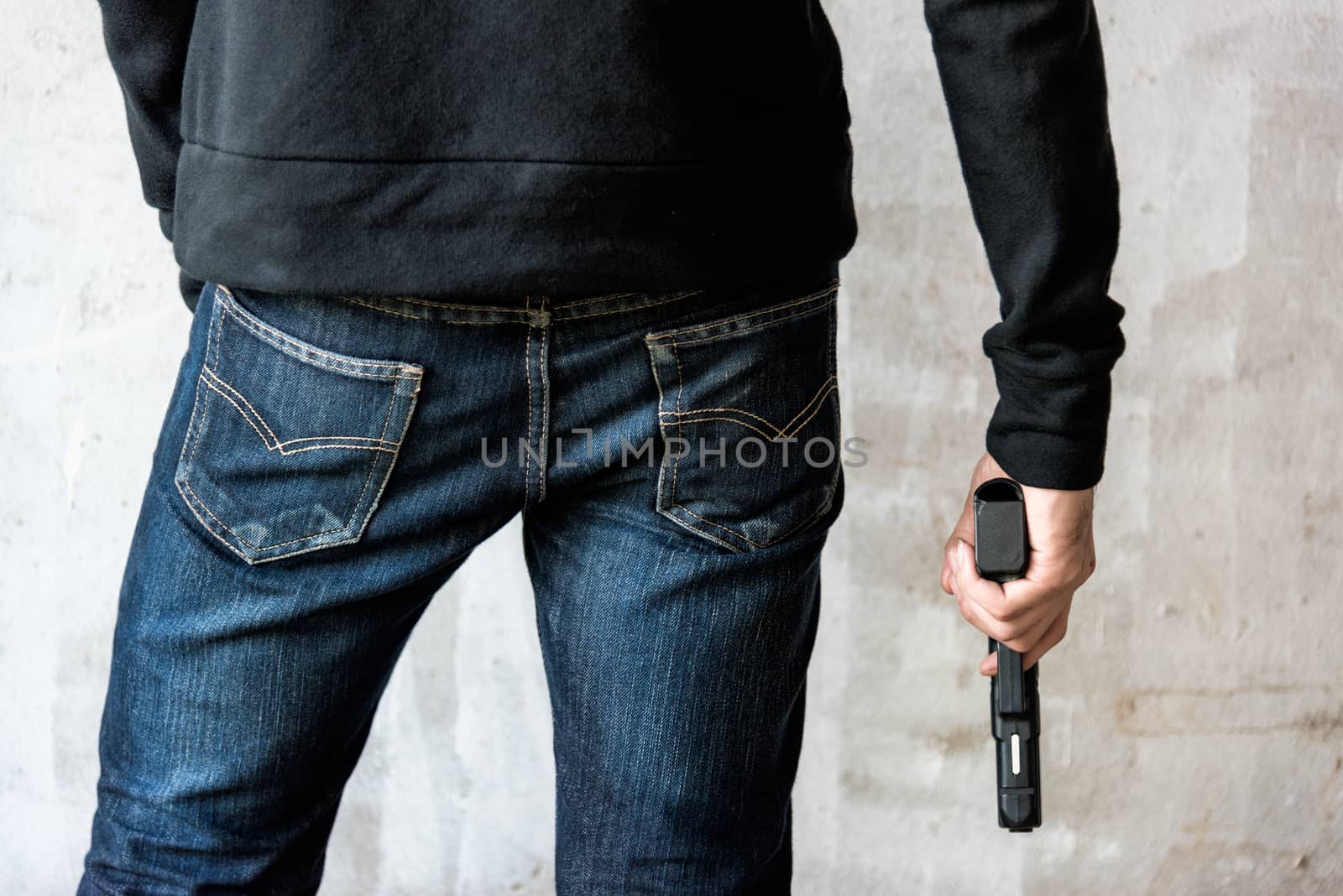 Killer holding a gun side him by Sorapop