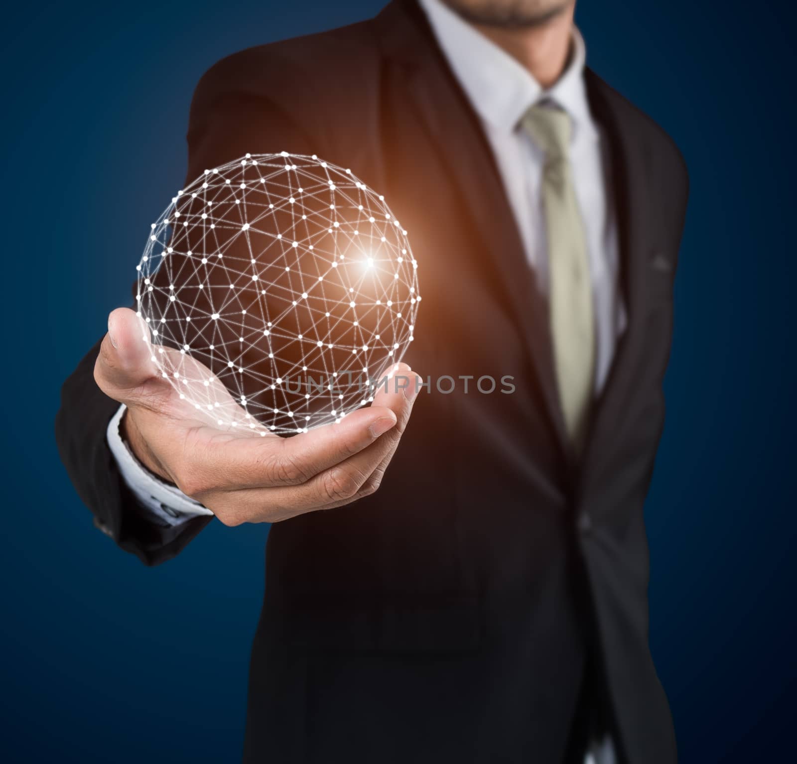 Businessman holding earth network interface connection on blue background