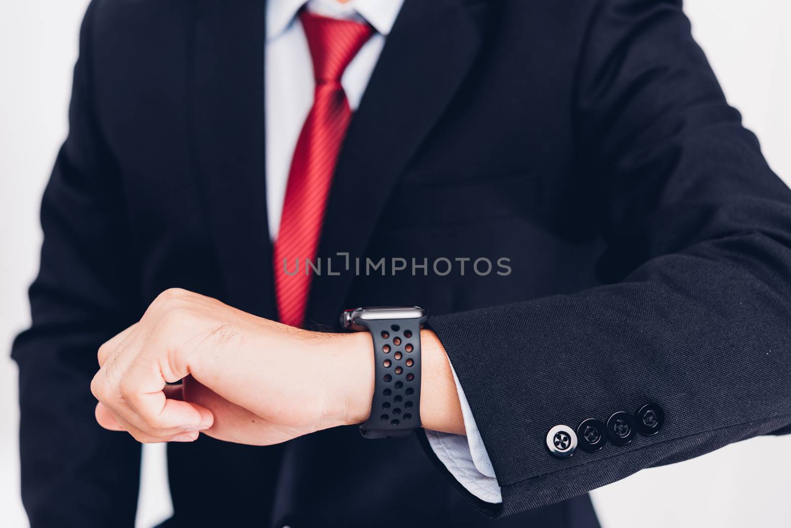 Business man wearable and he seeing smart watch on hand, by Sorapop