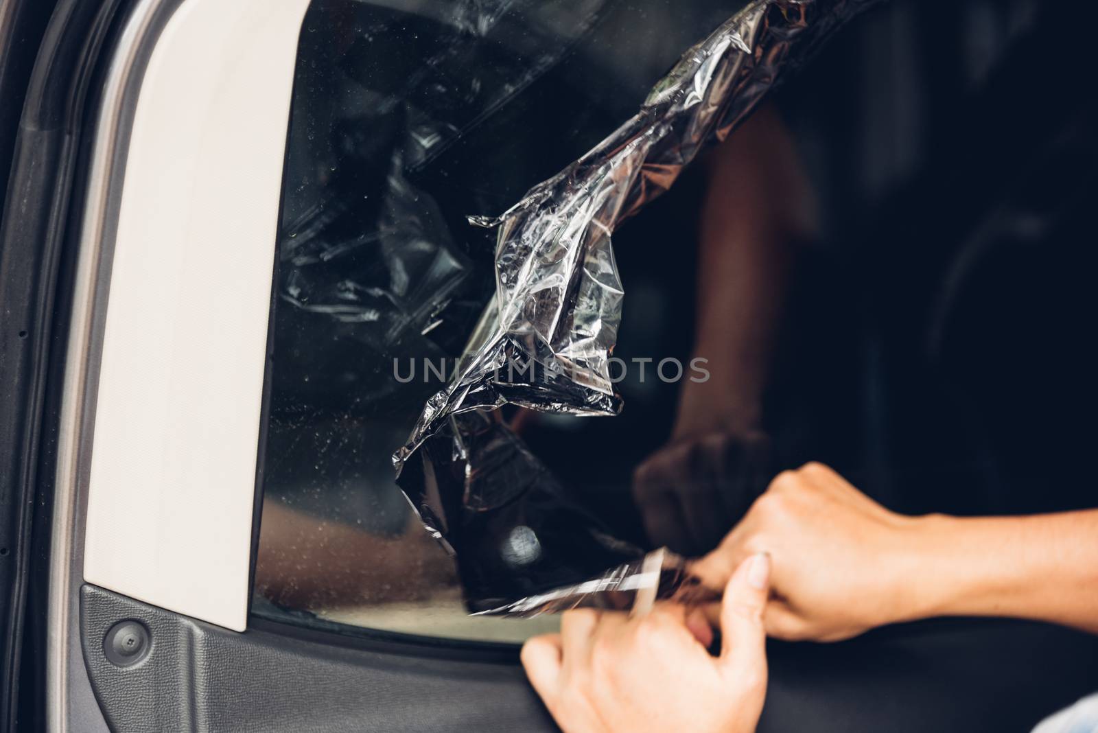 Specialist worker service peeling old film from window car