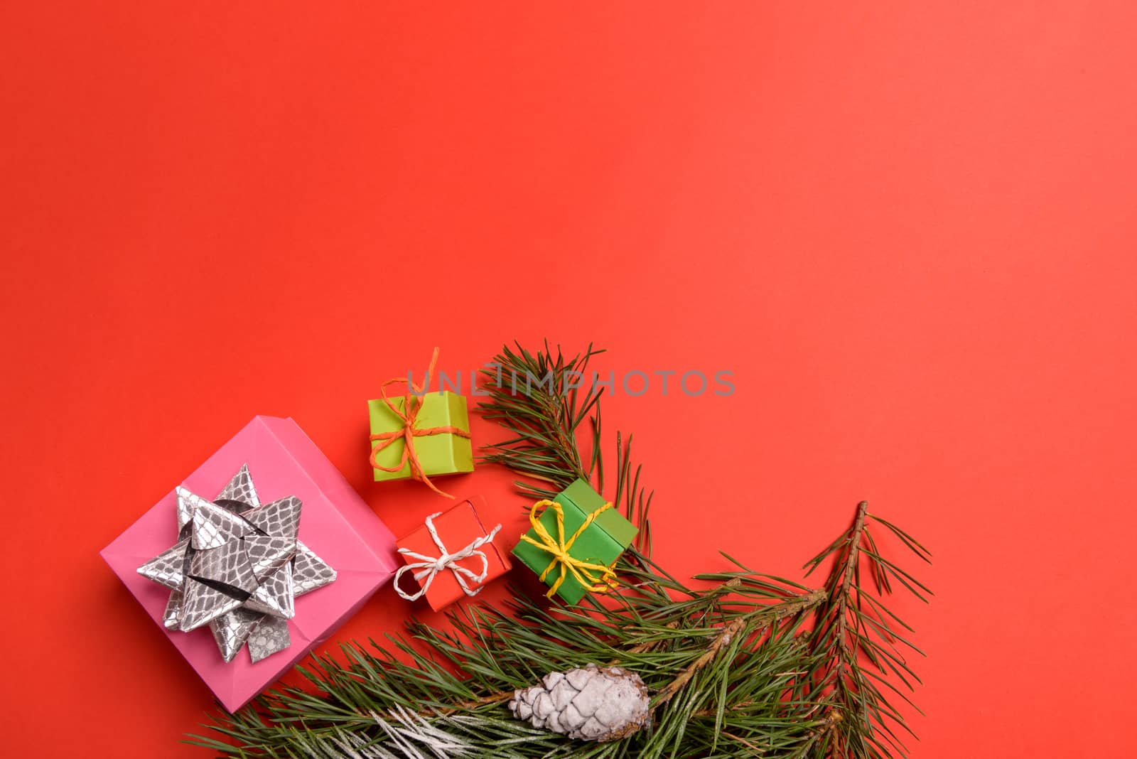Christmas or New Year background, plain composition made of Xmas decorations and fir branches, flat lay, blank space for a greeting text.