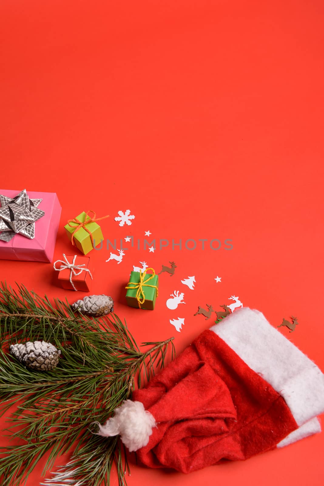Christmas or New Year background, plain composition made of Xmas decorations and fir branches, flat lay, blank space for a greeting text.