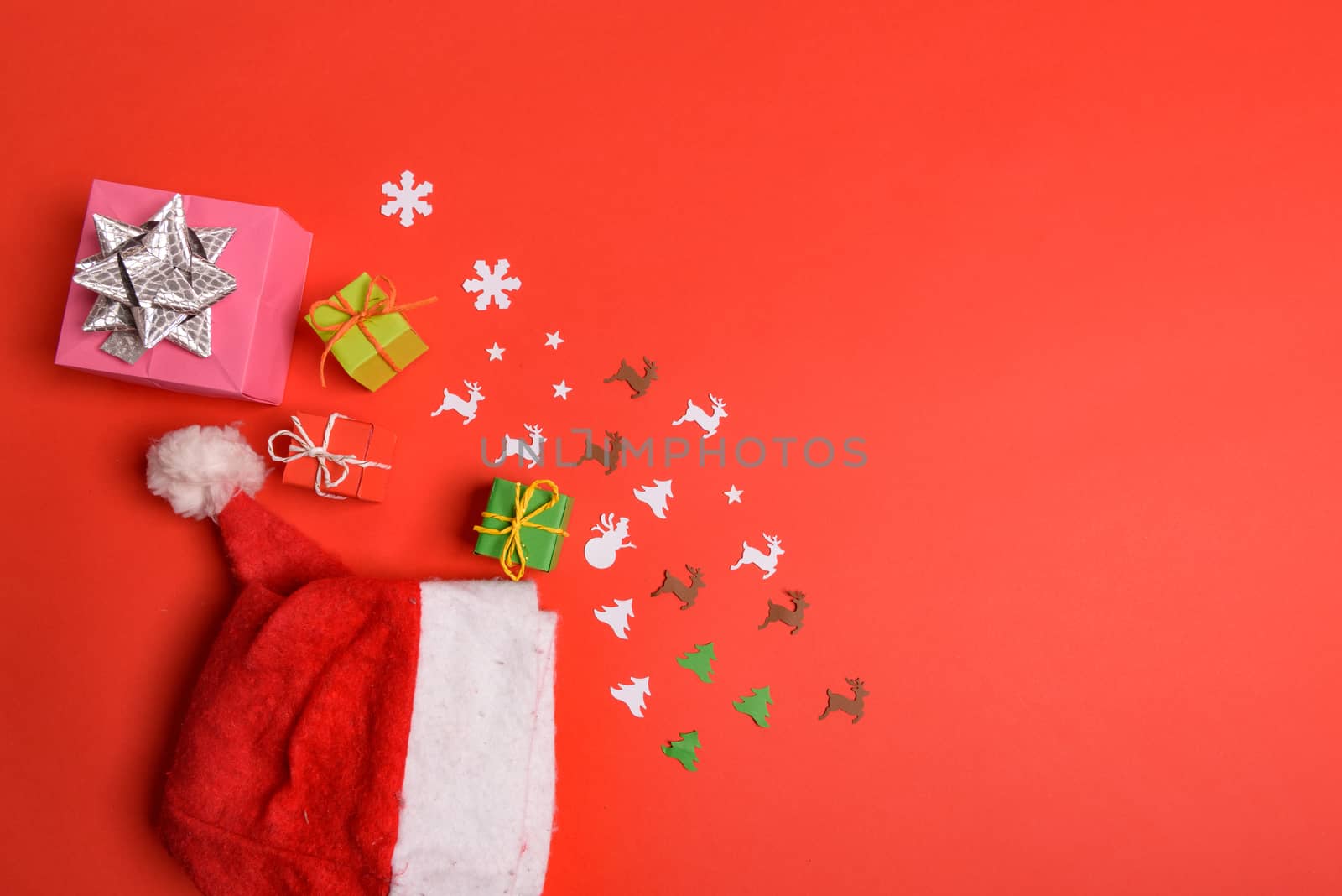 Christmas or New Year background, plain composition made of Xmas decorations and fir branches, flat lay, blank space for a greeting text.