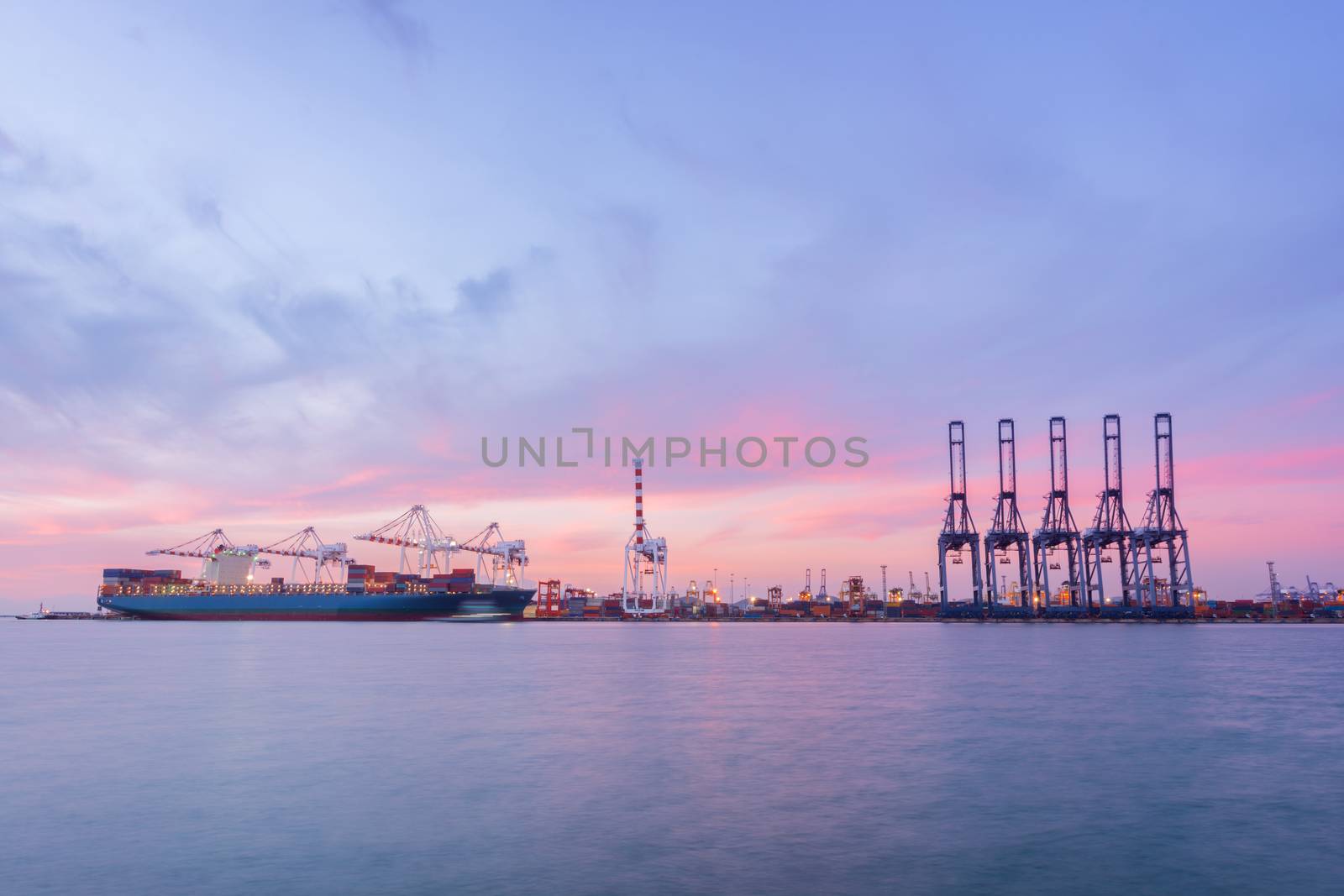 Containers loading by crane in the sunset, Trade Port , Shipping, transport