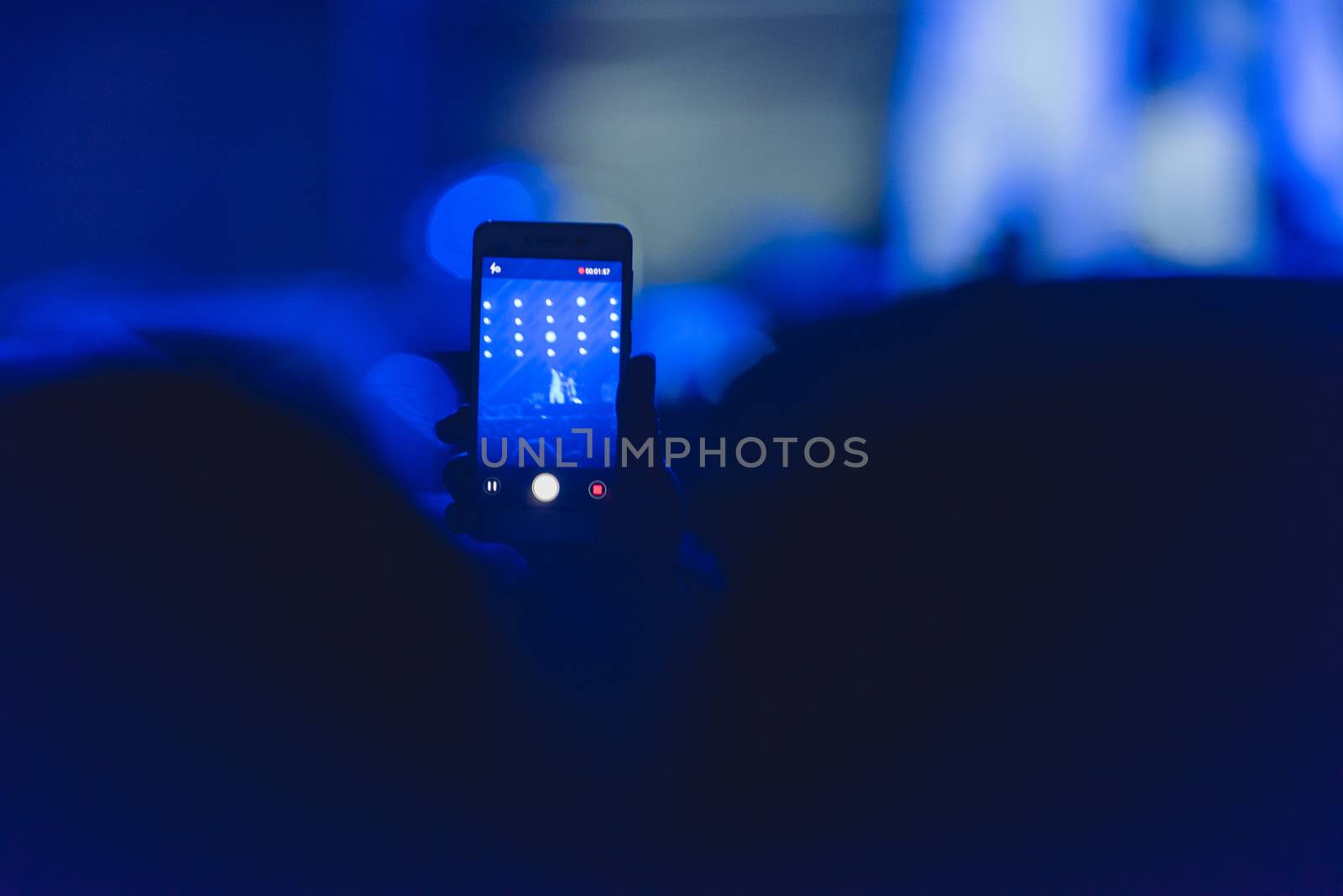 Event people live video festival music concert by hand holding smart mobile phone
