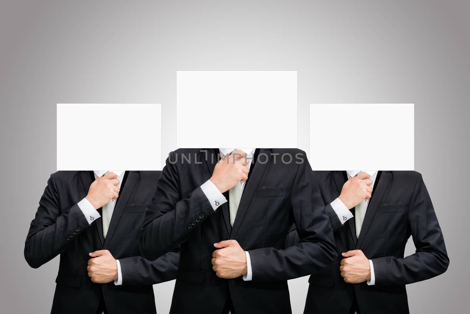 Businessman standing white paper face holding front of head on gray background