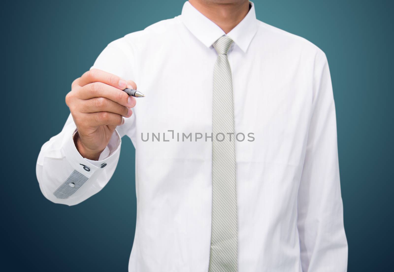 Businessman standing posture hand hold a pen isolated on over dark background