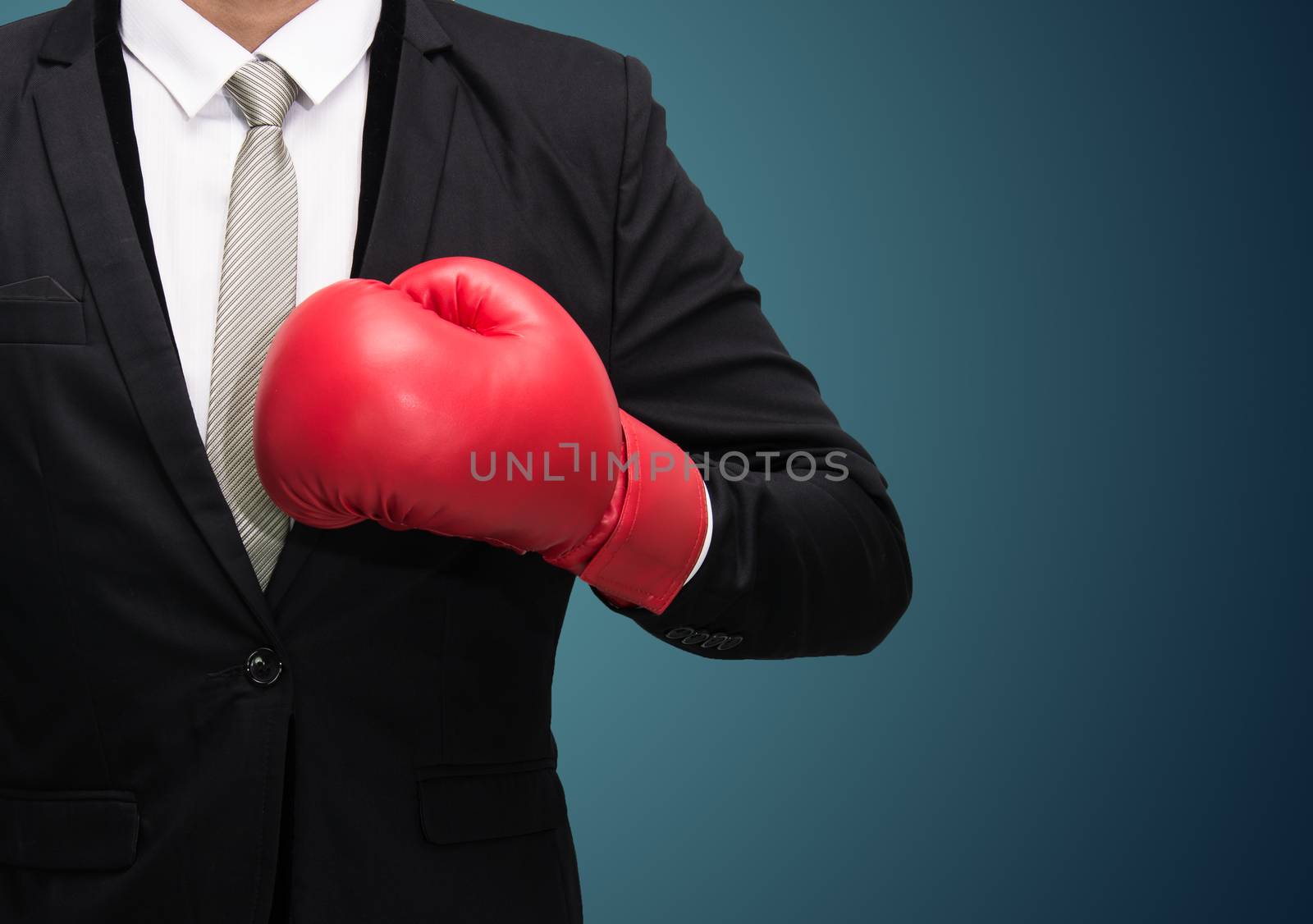 Businessman standing posture in boxing gloves isolated on over blue background