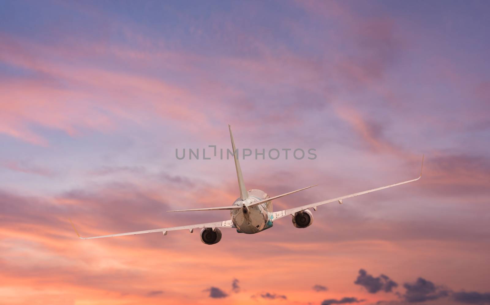 Airplane aft plane in the sky at sunset sky