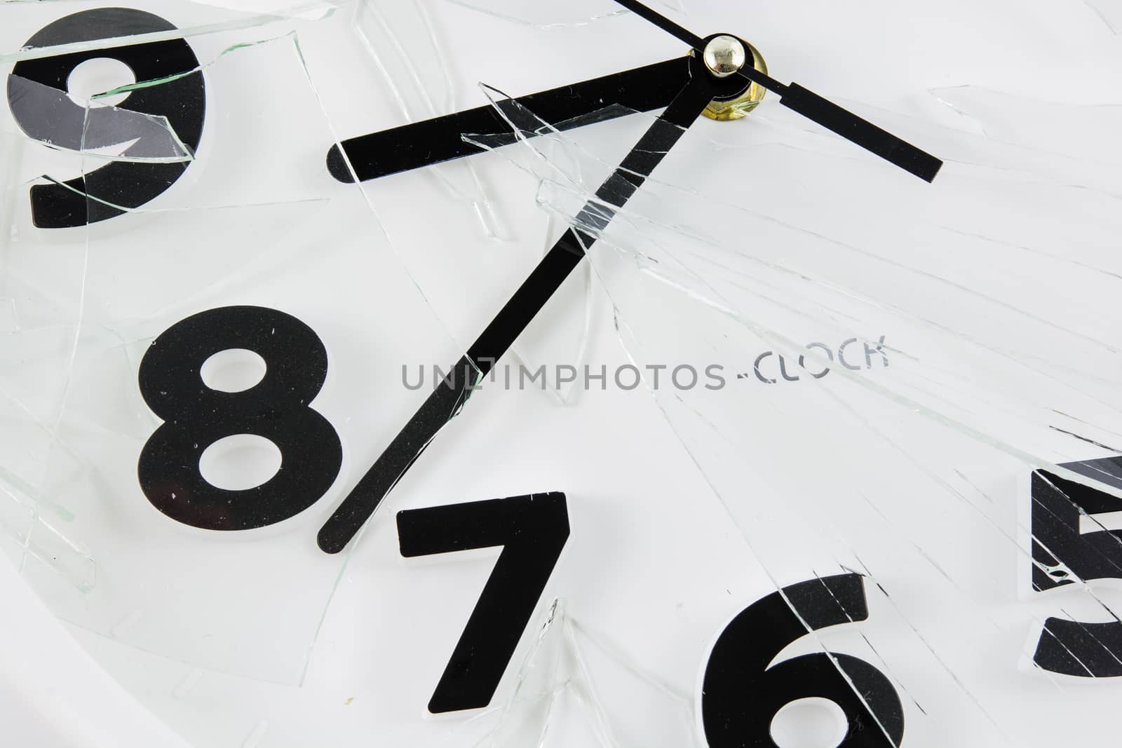 White clock is broken glass isolated on white background