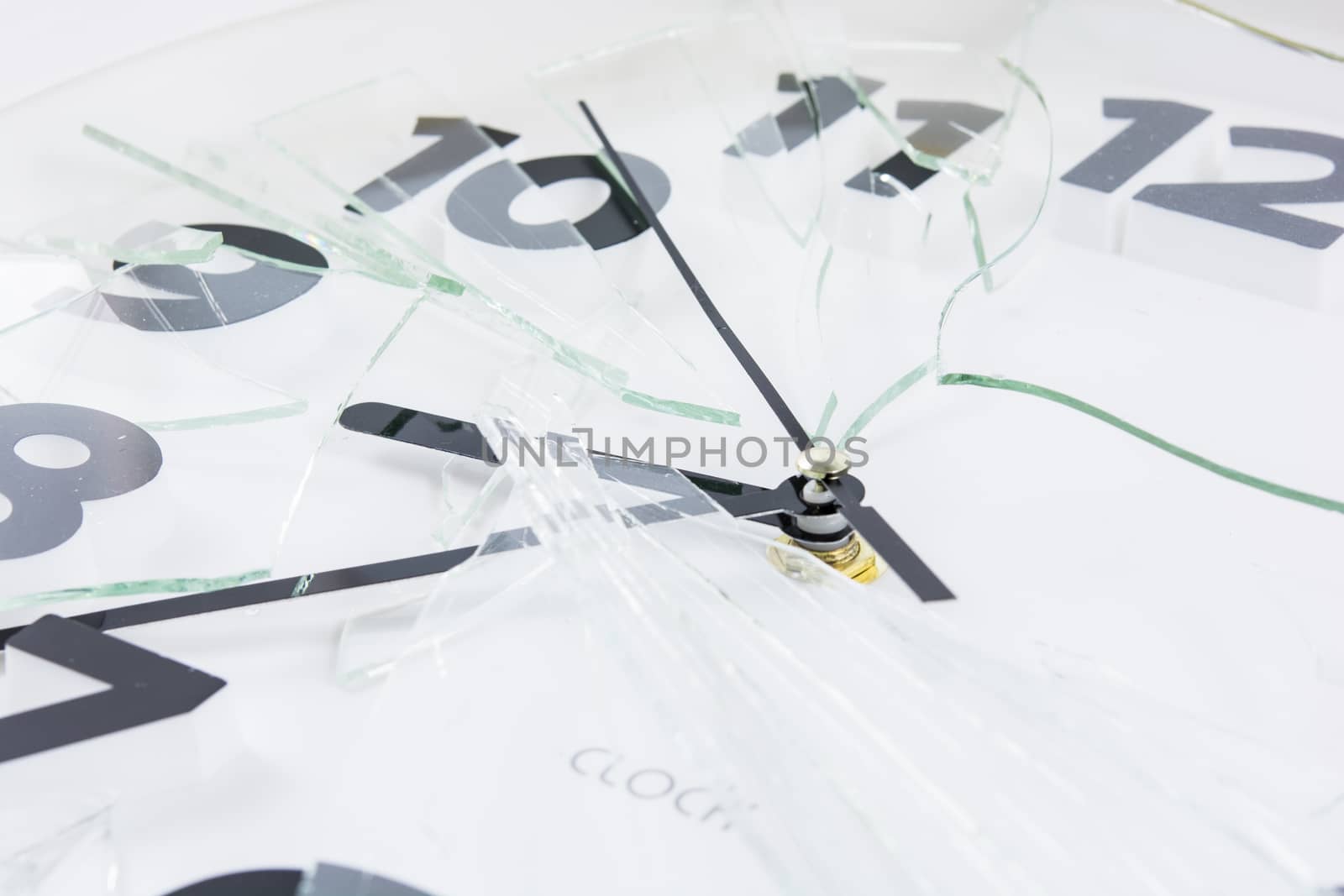 White clock is broken glass isolated on white background
